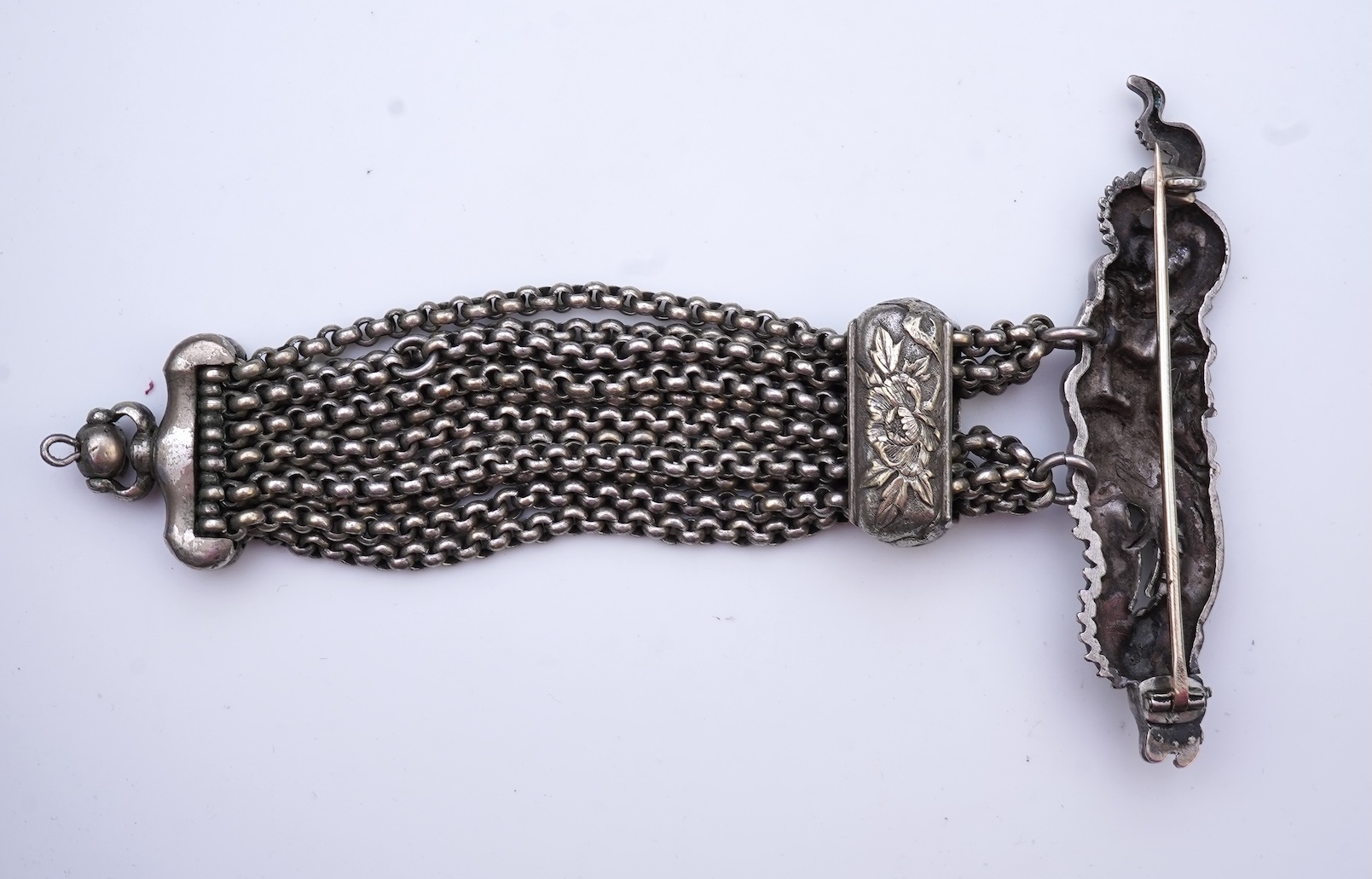 A chatelaine and a pair of serpentine bead earrings